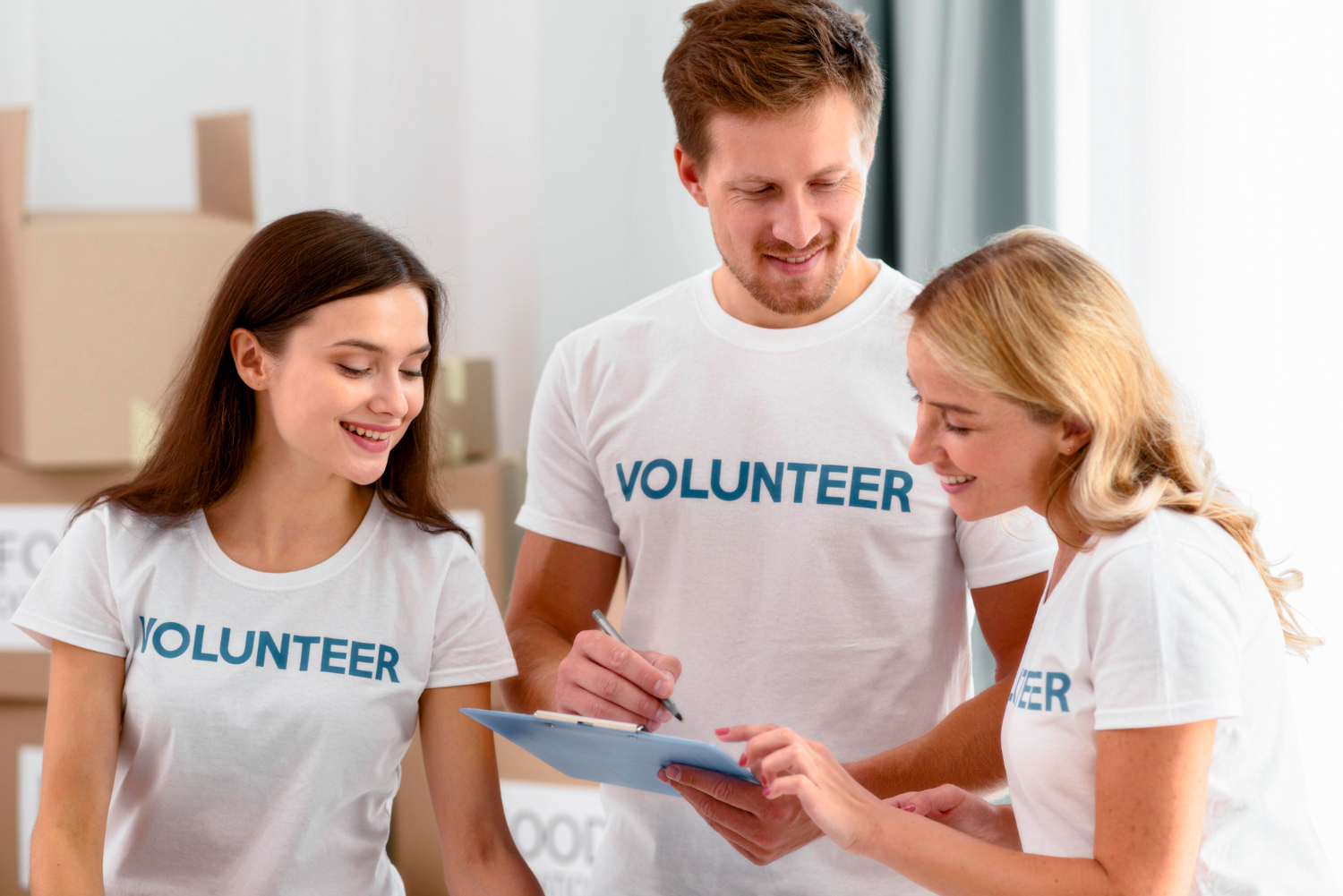 three volunteers in a group